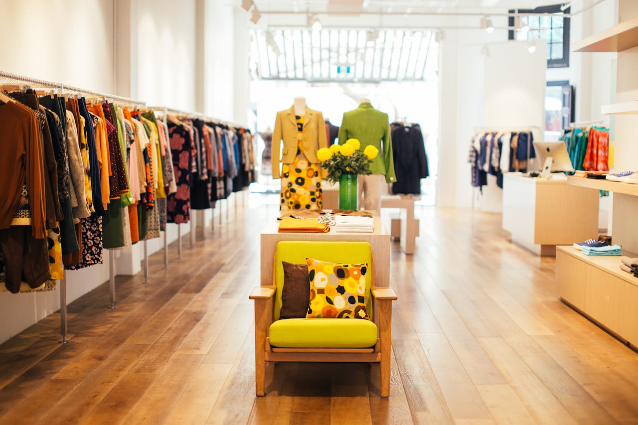 Interior of stylish boutique with colorful clothes